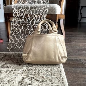 Gold cole hann bag